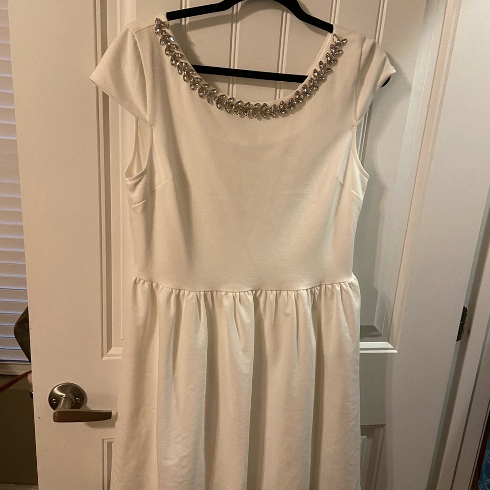 Beautiful White Dress with a rhinestone accent around the neck. Only worn once.